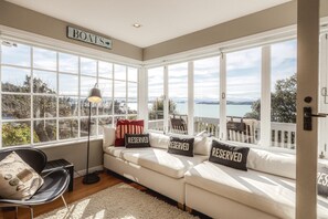 TV, fireplace, DVD player, stereo - The Boat House at Arran Bay - The Boat House at Arran Bay is a spectacular family holiday home in Arran Bay. With 4 bedrooms, plus caravan sleepout,it can sleep up to 8 adults and 12 guests in total. (Waiheke Island)