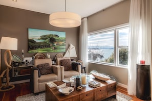 TV, fireplace, DVD player, stereo - The Boat House at Arran Bay - The Boat House at Arran Bay is a spectacular family holiday home in Arran Bay. With 4 bedrooms, plus caravan sleepout,it can sleep up to 8 adults and 12 guests in total. (Waiheke Island)