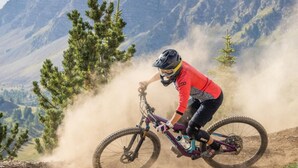 A mountain biker on a trail with a mountainous backdrop. - Luxury 4* Chalet with Jacuzzi and Sauna (Vars)