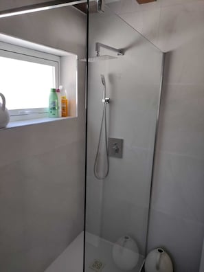 Shower, hair dryer, towels, soap