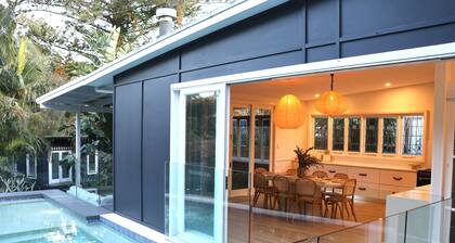 Beach bungalow with a pool.
