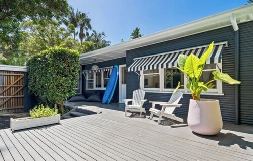 Beach bungalow with a pool.