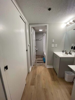 Shower, hair dryer, towels, shampoo