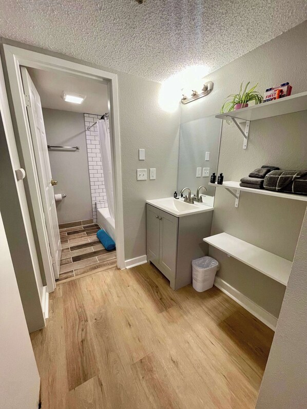 Shower, hair dryer, towels, shampoo