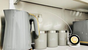 A kitchen counter with a kettle, a coffee maker, and containers labeled 'tea,' 'coffee,' and 'sugar.' - 5bed-10 Guests-near City Centre-free Parking (Leeds)