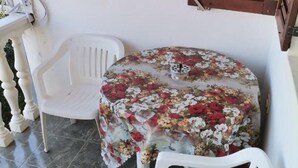 Apartamento | Restaurante al aire libre