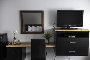 Family Room | Desk, laptop workspace, blackout drapes, iron/ironing board