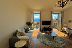 Family Apartment, Multiple Bedrooms, Beachside (Giardino Floreale di Menaggio) | Living area | Flat-screen TV