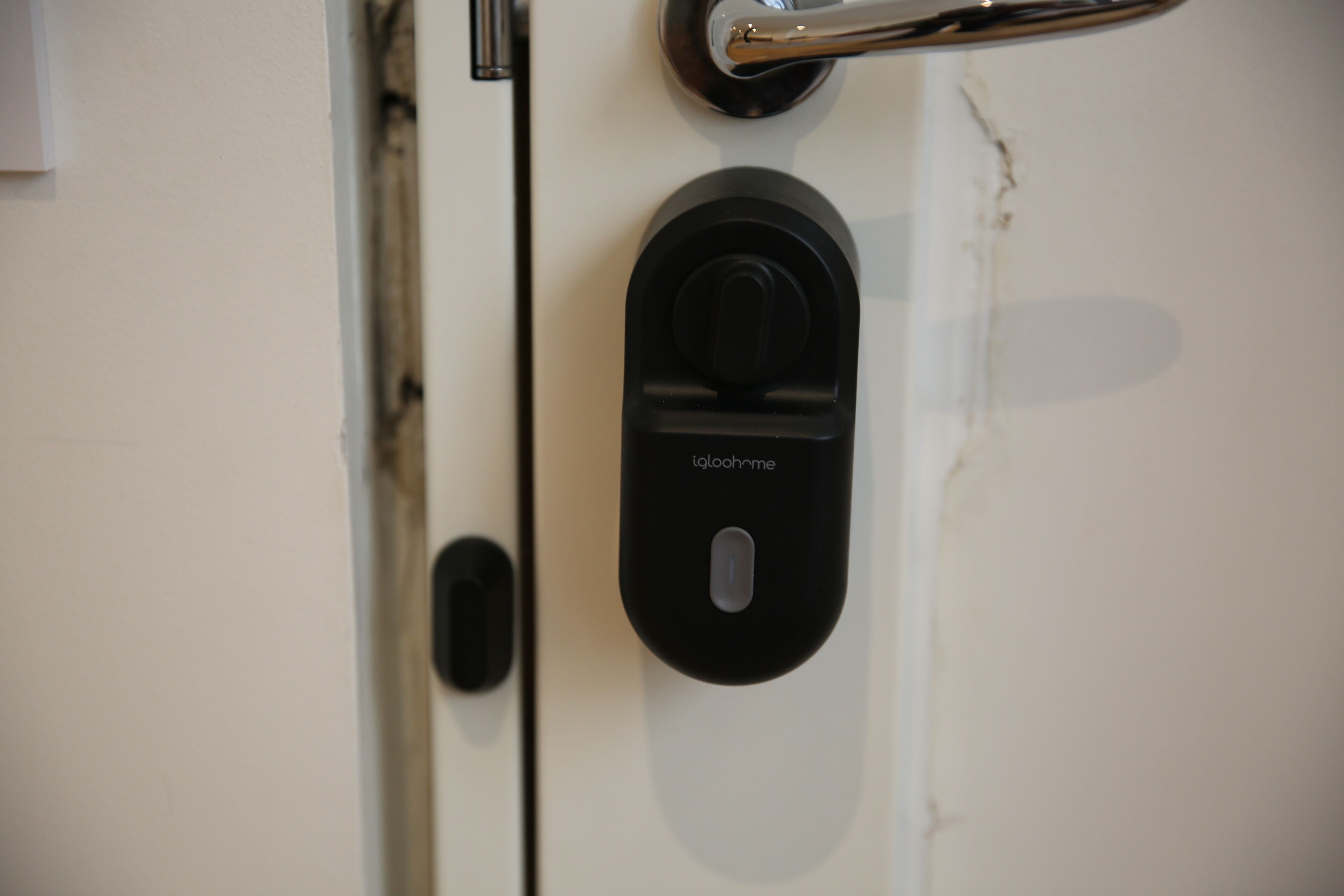 A door with a keyhole and a lock mechanism.