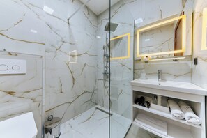 Shower, hair dryer, towels, soap