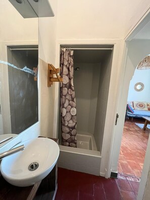 Shower, hair dryer, towels, toilet paper