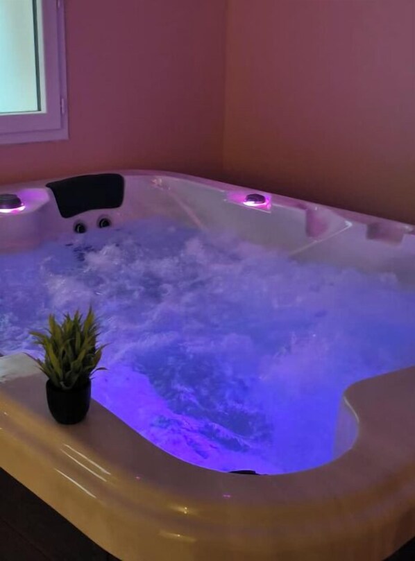 Relax in a hot tub with a soothing view.