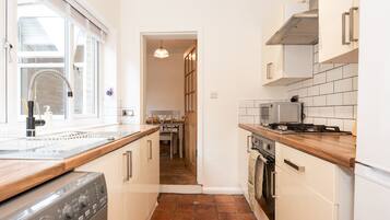 Fridge, microwave, toaster, cookware/dishes/utensils