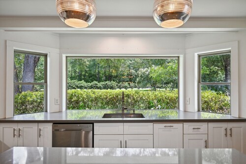 "Whispering Oaks"  Enjoy this 4-bedroom home with HUGE backyard