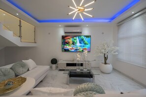 Kahden hengen deluxe-huone, näköala puutarhaan | Oleskelualue