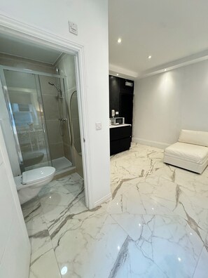 Shower, hair dryer, towels, soap