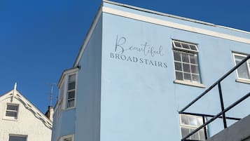 A building with the sign 'Beautiful BROAD STAIRS' on its facade.