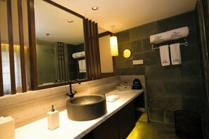A modern bathroom with a large mirror, a round sink, and a towel rack. - Gongga cliff Hot Spring Hotel (Luding)