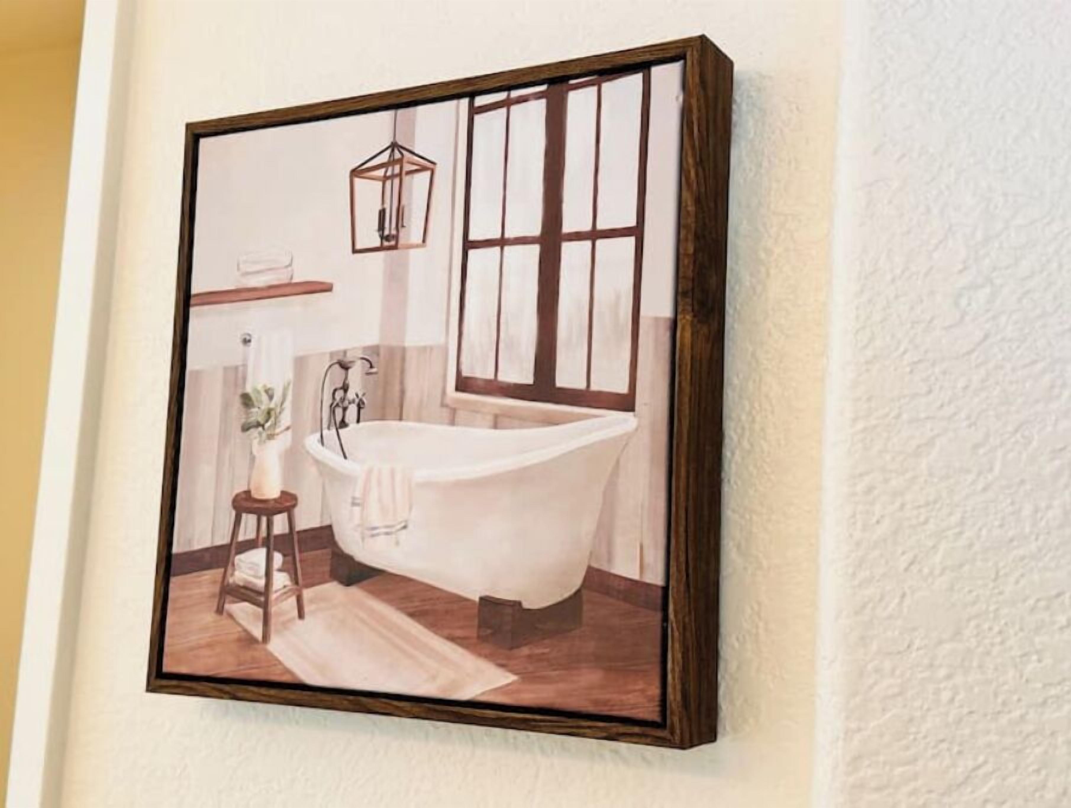 A framed painting of a bathroom with a bathtub, a window, and a hanging light fixture.