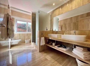 Shower, jetted tub, hair dryer, bidet