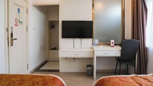 A hotel room with two beds, a desk with a flat-screen TV, a chair, and a wardrobe. - Daying Hotel (Ningbo)