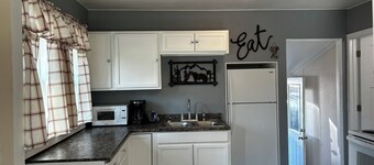 This cozy house has been completely remodeled inside and features three bedrooms.