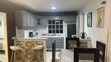 Fridge, microwave, stovetop, coffee/tea maker