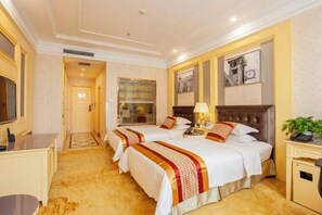A hotel room with two beds, a desk, a chair, and a television. - Qingping Hotel (Xinmi)