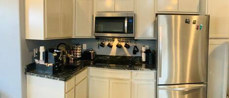 Fridge, microwave, dishwasher, coffee/tea maker