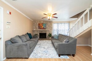 TV, fireplace, books - Urban Oasis: In the Medical Center (San Antonio)