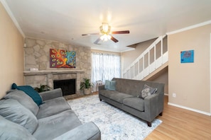 TV, fireplace, books - Urban Oasis: In the Medical Center (San Antonio)