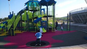 A playground with slides and climbing structures.