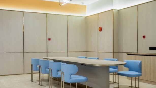 A conference room with a long table, six blue chairs, and a podium. - HanTing Hotel (Jiande Xin'an River Xindian) (Jiande)