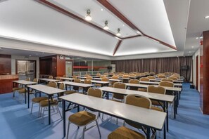 A conference room with tables and chairs arranged for meetings. - Halcyon Hotel & Resort (Yingtan)