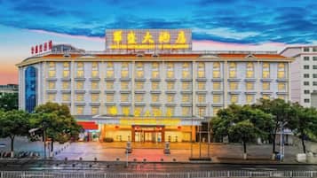 A large hotel with multiple floors and a prominent entrance.