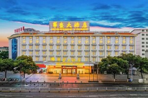 A large hotel with multiple floors and a prominent entrance.