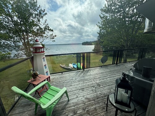 Relaxing Cedar Log Cottage on Bras d'Or Lake over 300 Ft Private Beach & Kayaks