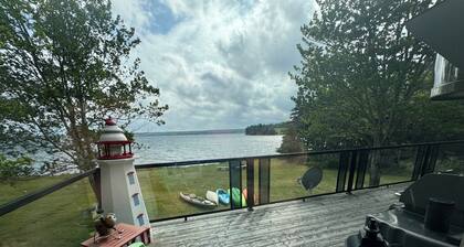 Relaxing Cedar Log Cottage on Bras d'Or Lake over 300 Ft Private Beach & Kayaks