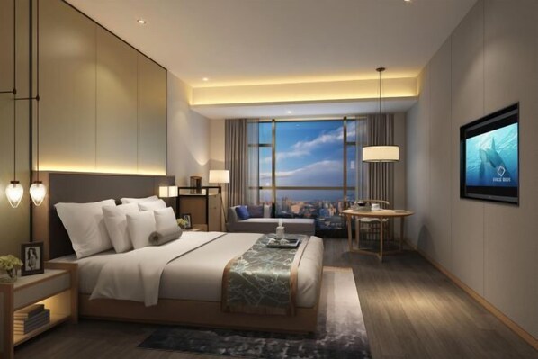 A modern hotel room with a large bed, a desk, and a view of the city. - CHOUERY International Hotel (Wenzhou)