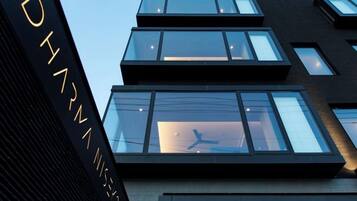 A modern building with multiple floors and large windows.