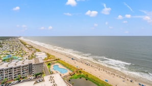 A coastal hotel with a pool, beach access, and ocean views.