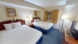 A hotel room with two beds, a television, and a desk with a lamp. - Atlantica 154, Beachfront Myrtle Beach Sping Retreat (Myrtle Beach)