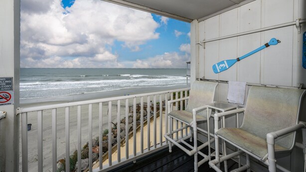 A balcony with a view of the ocean, white railings, and two white chairs. - Oceanfront 2BD- Cherry Grove Point- Ocean View K3 (North Myrtle Beach)