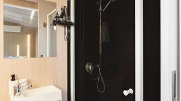 Shower, hair dryer, towels, shampoo