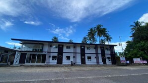 A two-story building with a flat roof and large windows. - H Mansion Hotel (Tandag)