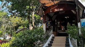 A staircase leading to a wooden building with a sign reading "Shanti-La Island Resort." - shari-la Perhentian Island Resort (Pulau Perhentian Kecil)