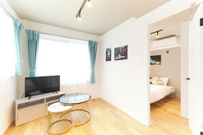 A (3-person), Non Smoking | Living area | Flat-screen TV