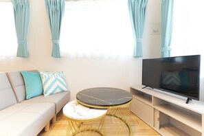 A (3-person), Non Smoking | Living area | Flat-screen TV
