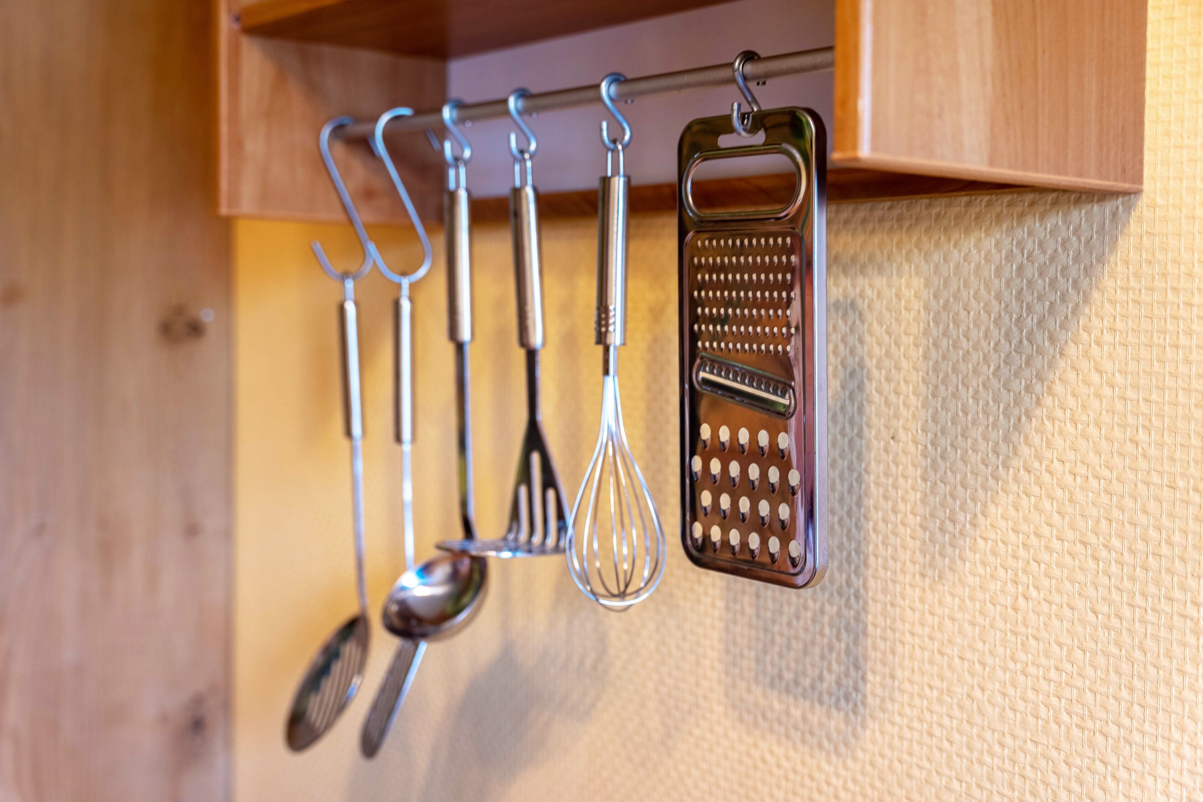 A kitchen utensil rack with various utensils.