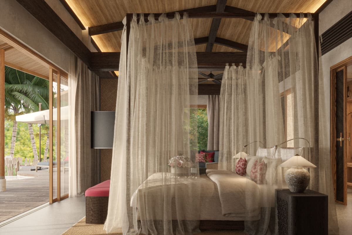Un dormitorio con cama a dosel, televisor de pantalla plana y un florero de piedra sobre una mesita de noche.